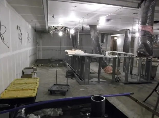 Interior construction progress showing renovation of the existing property